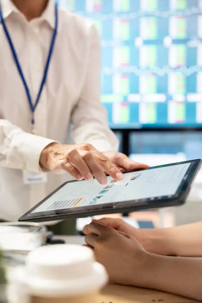 Healthcare professional reviewing patient documentation and compliance data within Footprints EMR software